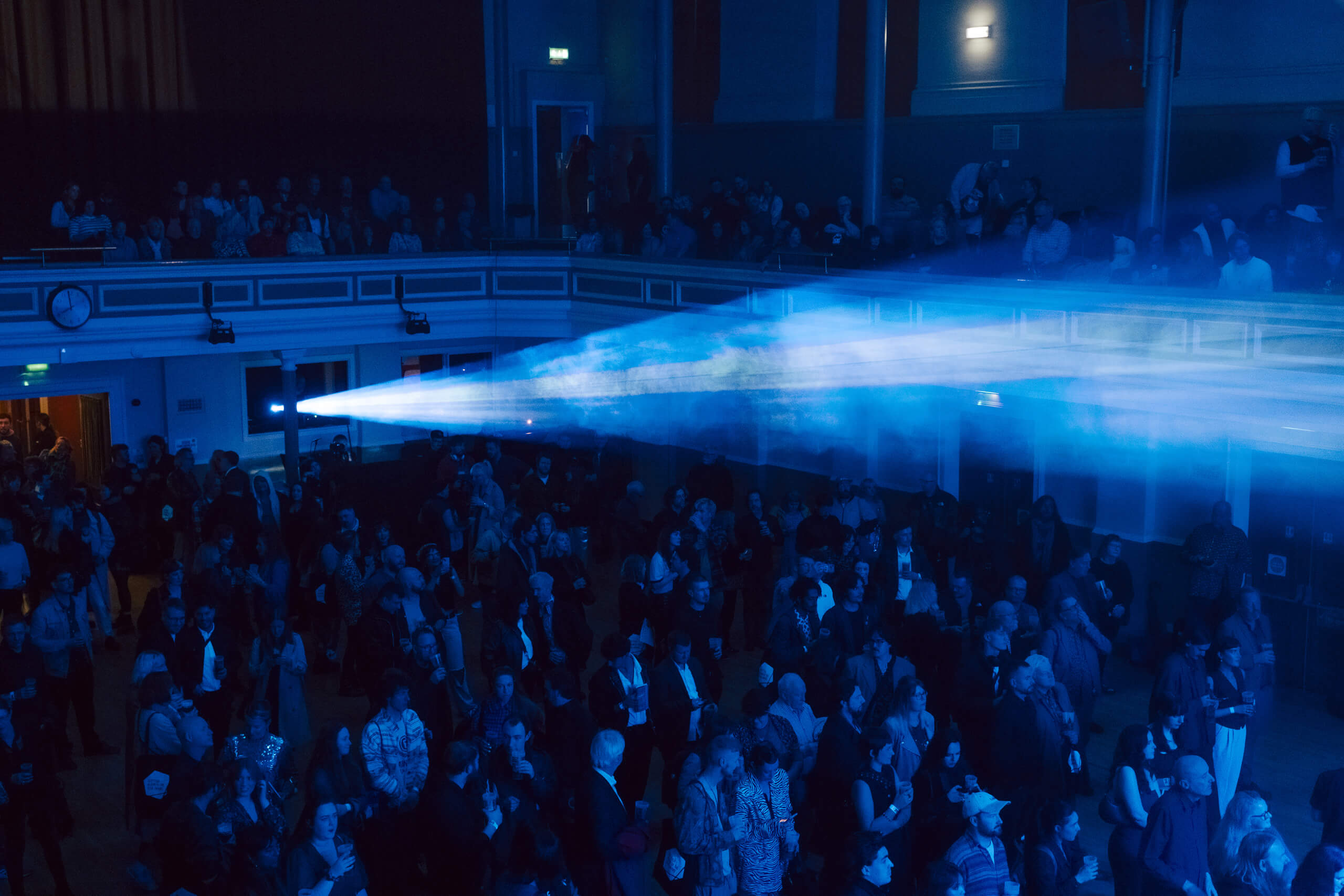 A photo of the crowd at The SAY Award with blue lighting